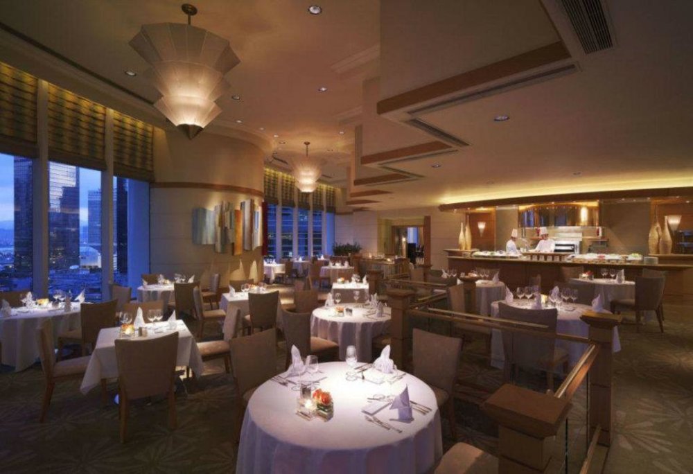 dim dining area at Brasserie on the Eighth at conrad hong kong