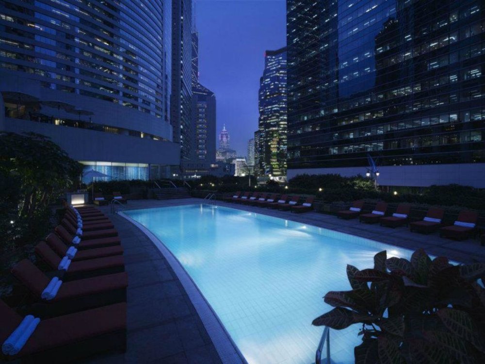 outdoor pool in conrad hong kong at night 