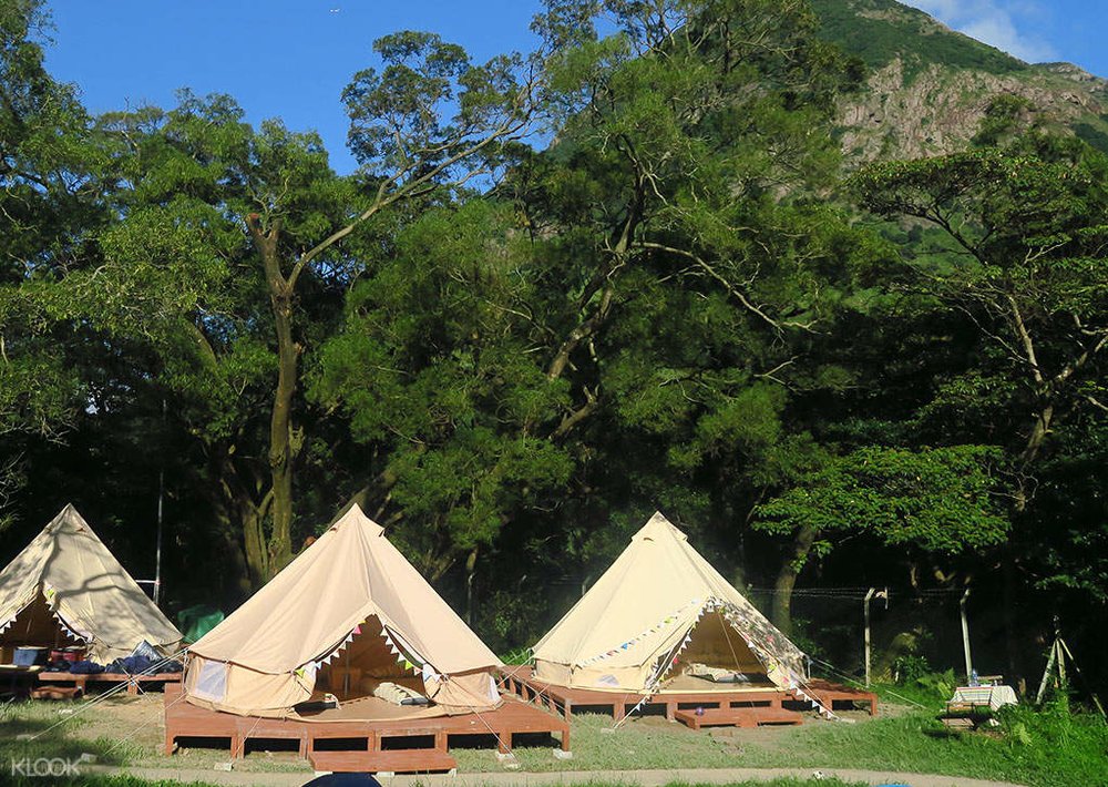 three bell tents in glamping site in hong kong