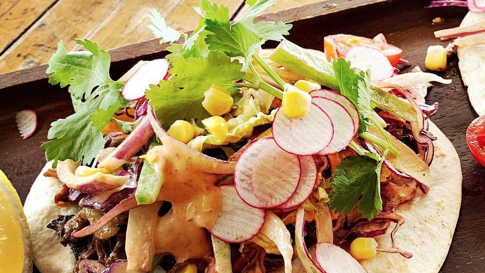 Grab a bite to eat at one of Airlie Beach’s finest restaurants. Image credits: @fatfrogbeachcafe on Instagram