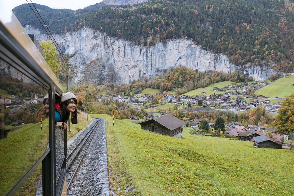 woman traveling by train in switzerland