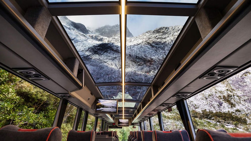 Enjoy the picturesque drive onboard a coach with massive windows