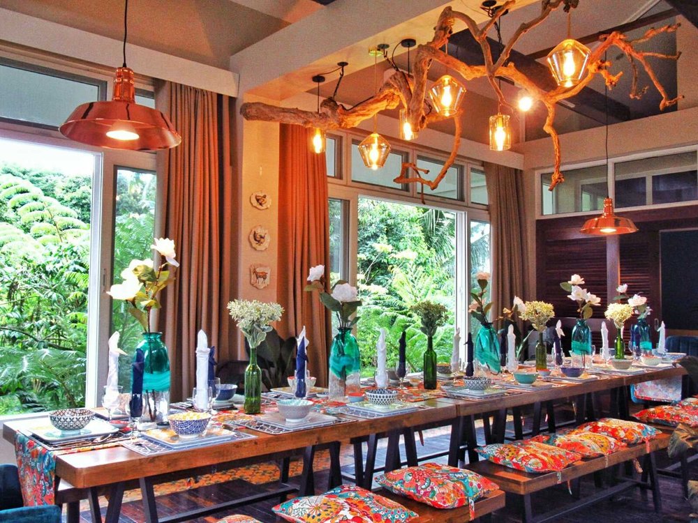 long dining table with floral chairs at hotel kimberly tagaytay