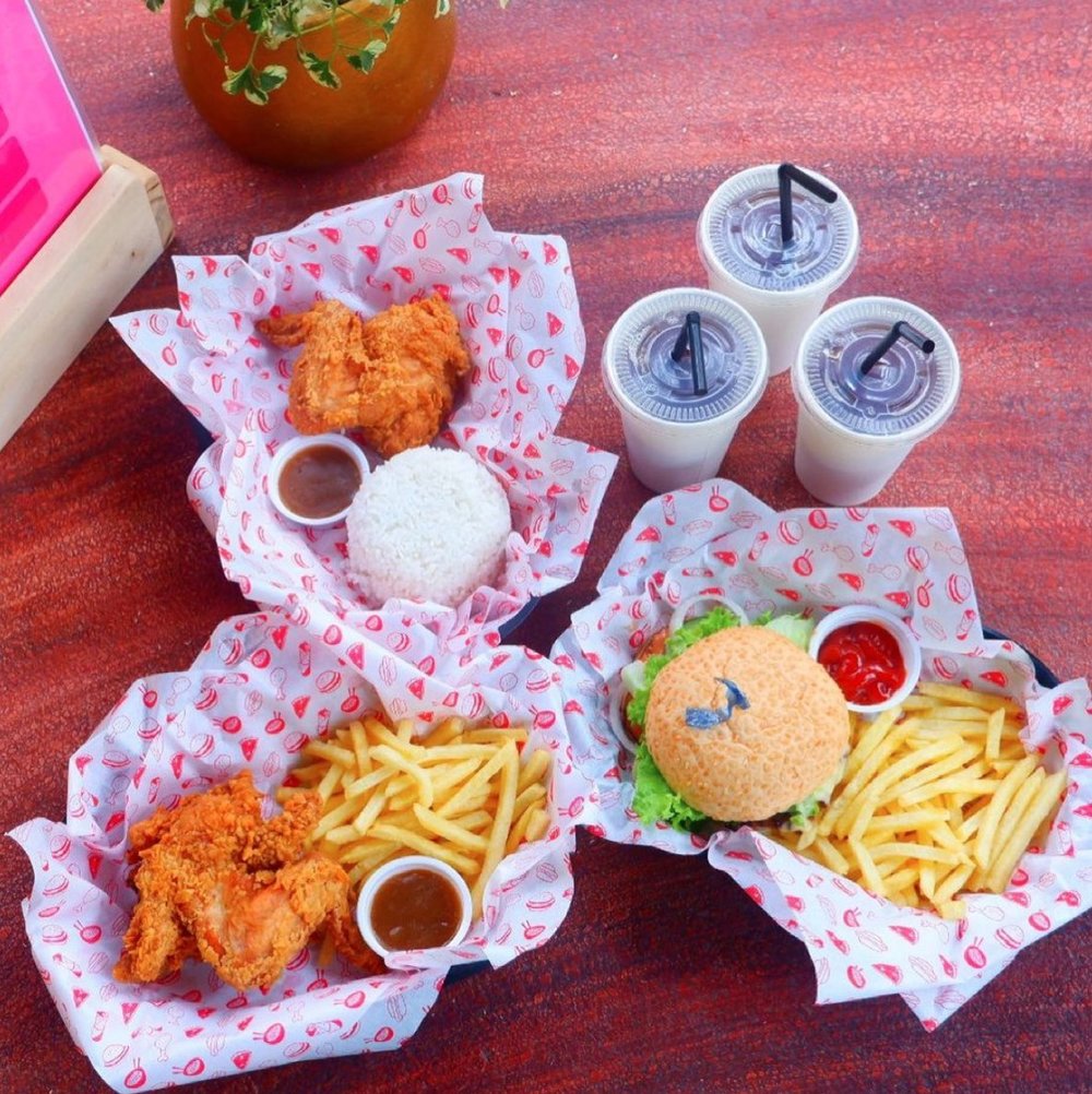 burger fries chicken and drinks at dinosaurs island