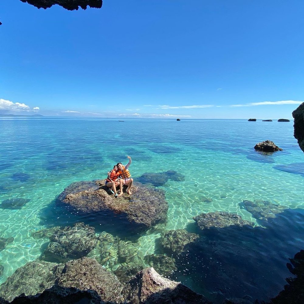 couple in crystal cave beach near boracay