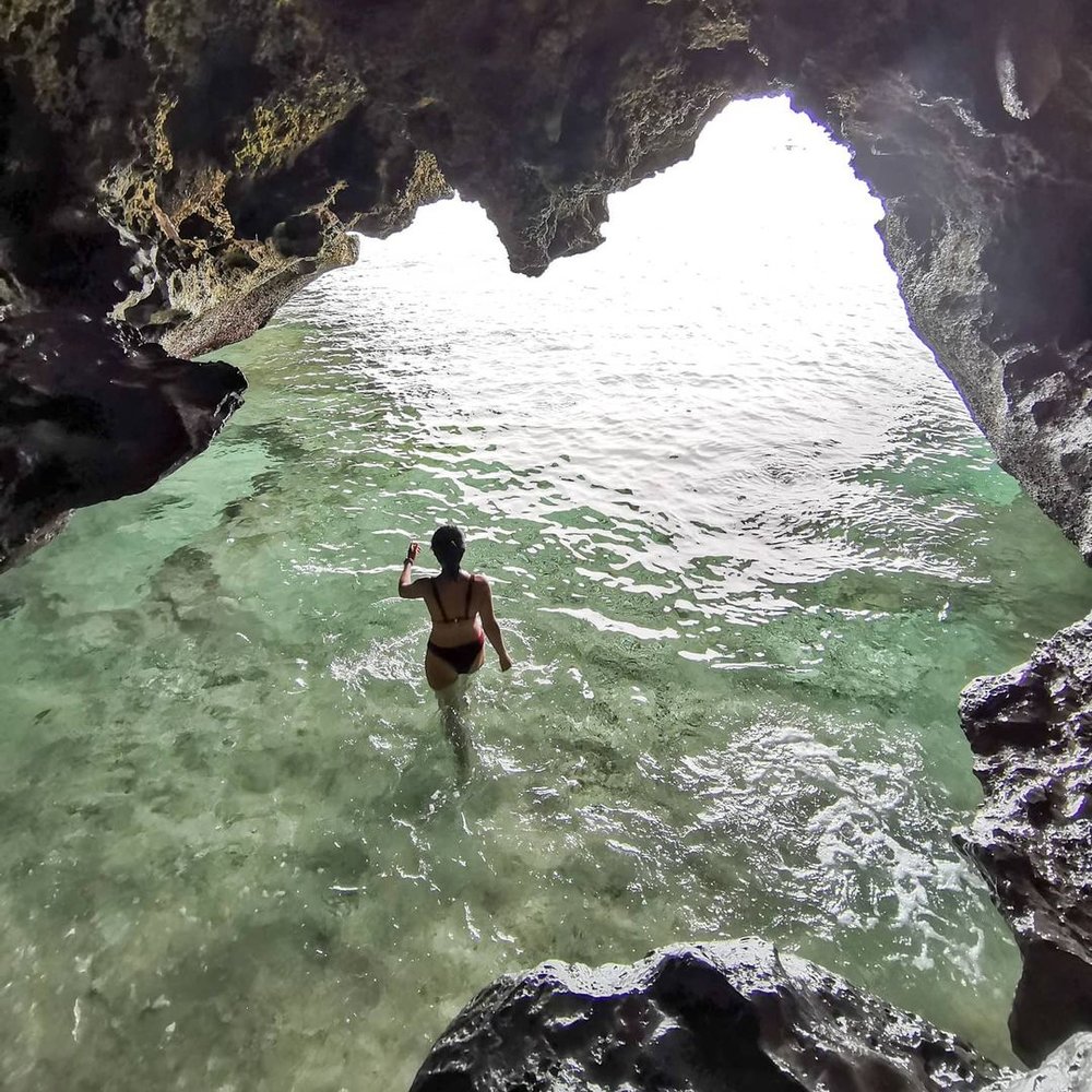 woman swimming in cave at crystal cove near boracay