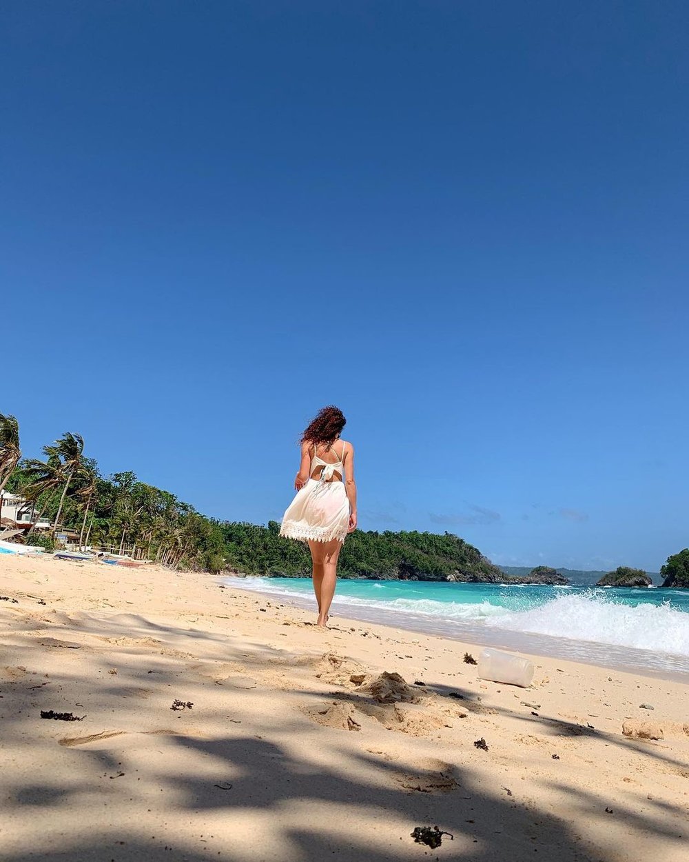 girl walking on shore at Ilig-Iligan Beach near boracay