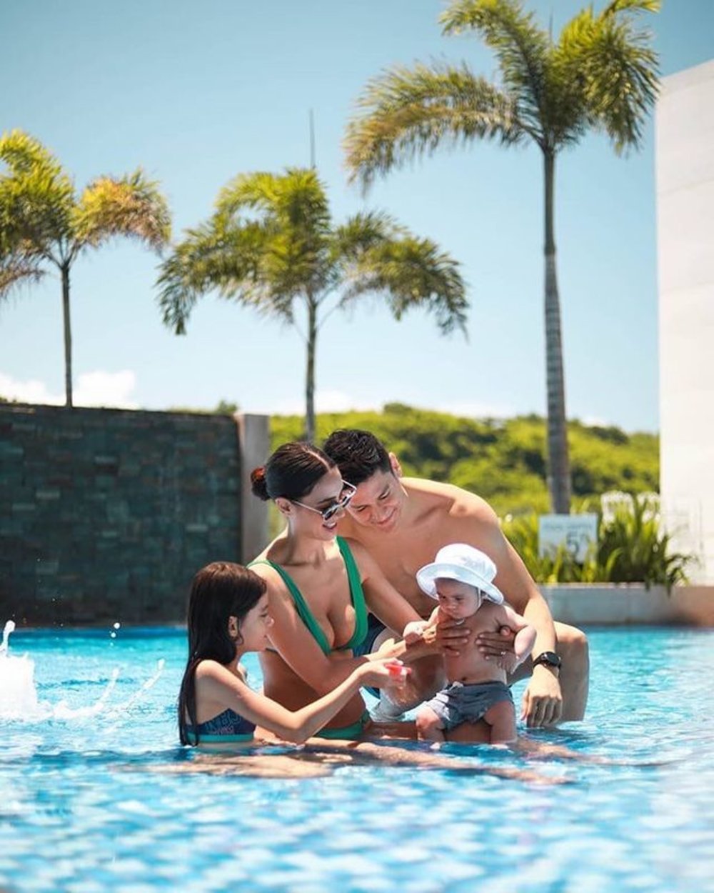 family of four in pool at belmont boracay