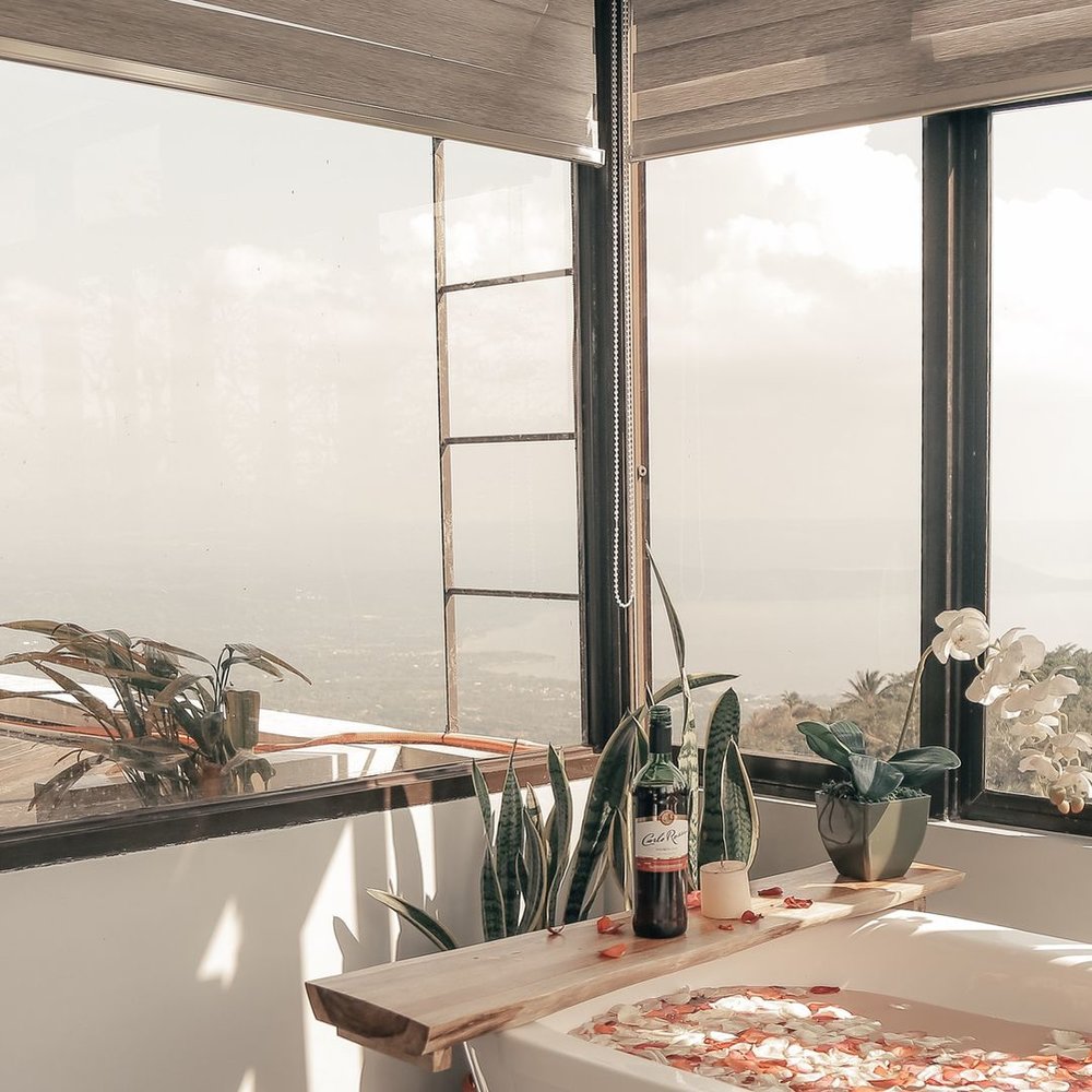 romantic view with bathtub laden with flowers