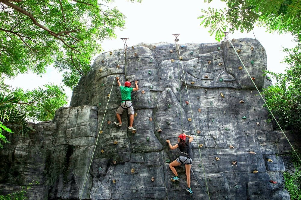 boy and girl wall-climbing