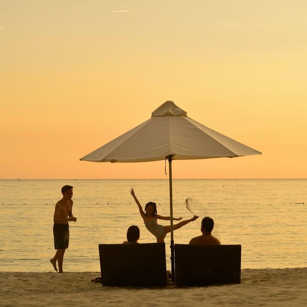 family enjoying at the beach