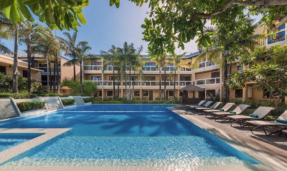 swimming pool with lounge chairs
