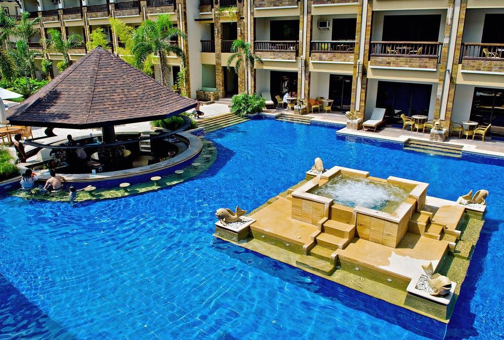 swimming pool with bar and fountain