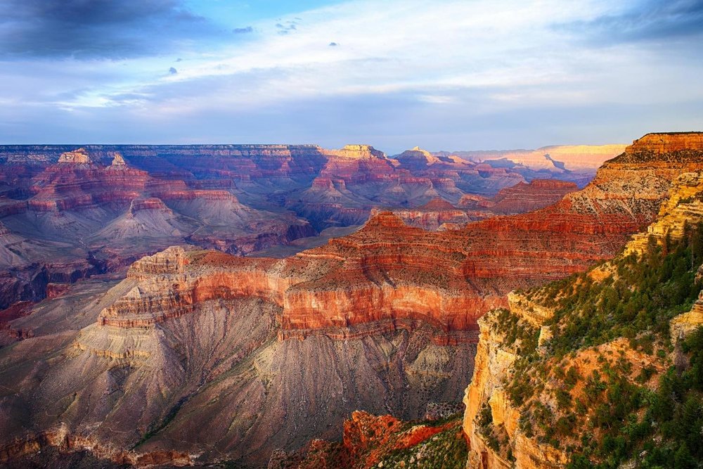 This impressive view of the Grand Canyon’s multi-colored rock formation awaits!