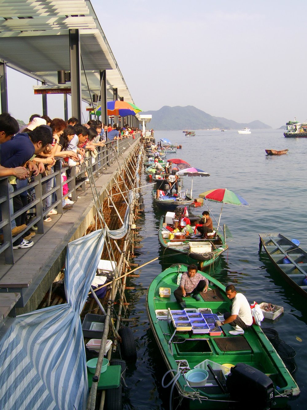 fishermen selling on the sides of sai kung pier hong kong