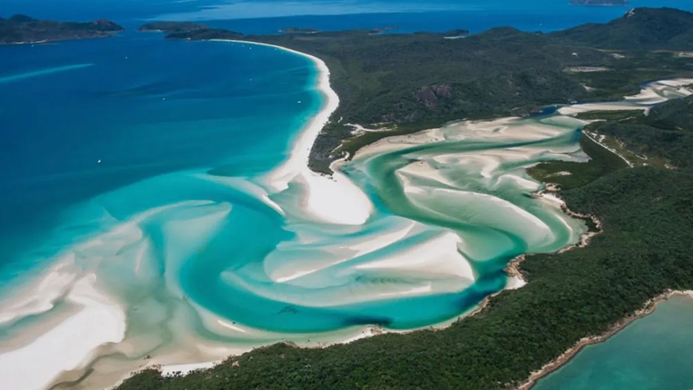 Marvel at the white sand and the blue waters from above