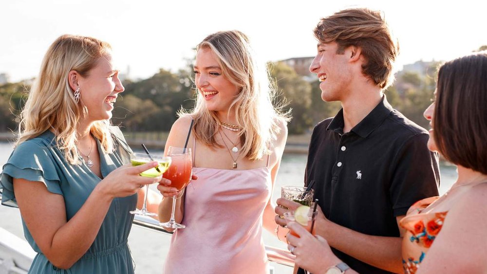 Enjoying food and cocktails aboard a Sydney 2000 on the Sydney Harbour Bar Cruise