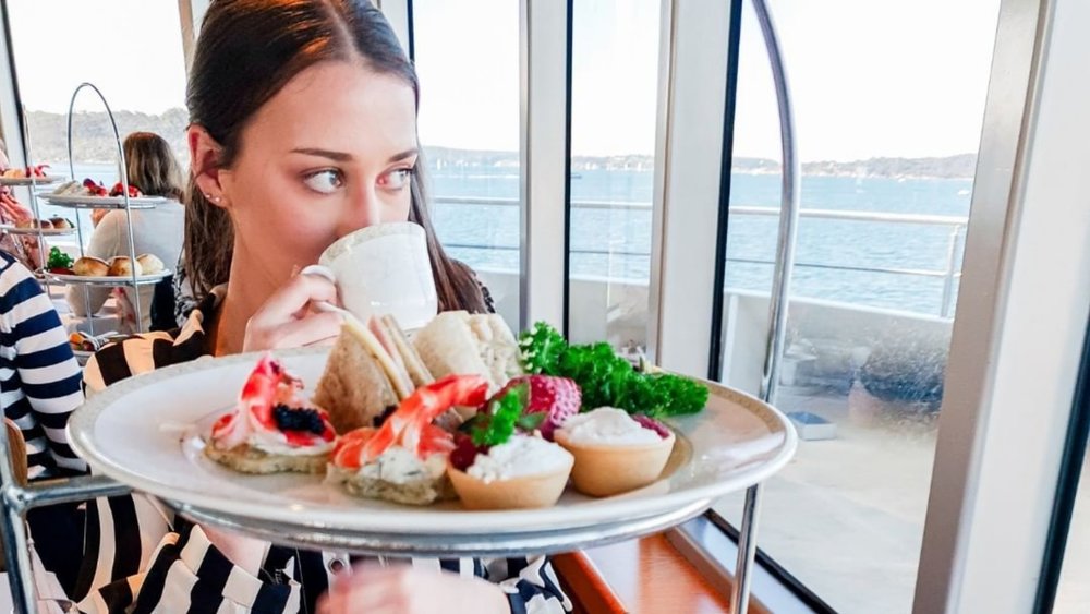 Have some afternoon treats on a Sydney Harbour High Tea Cruise. Image credits: @captaincookcruises on Instagram