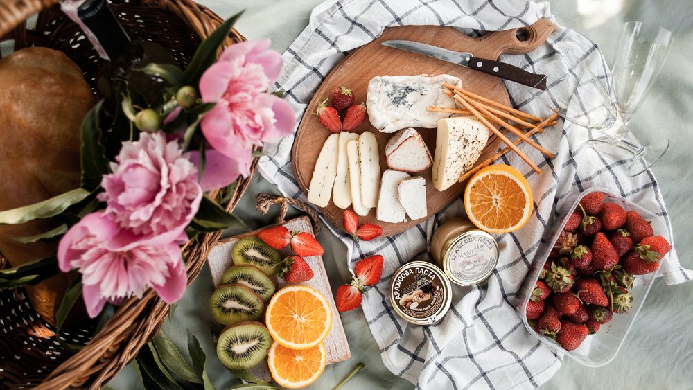 Pack some fresh fruits and cheeses for a great picnic. Image credit: Kate Hliznitsova on Unsplash