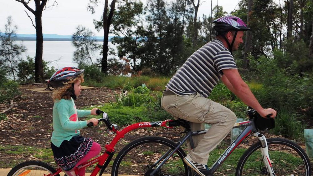 Even the little ones can join in the fun on a bike ride around Jervis Bay. Image credit: @kiddingaroundaustralia on Instagram