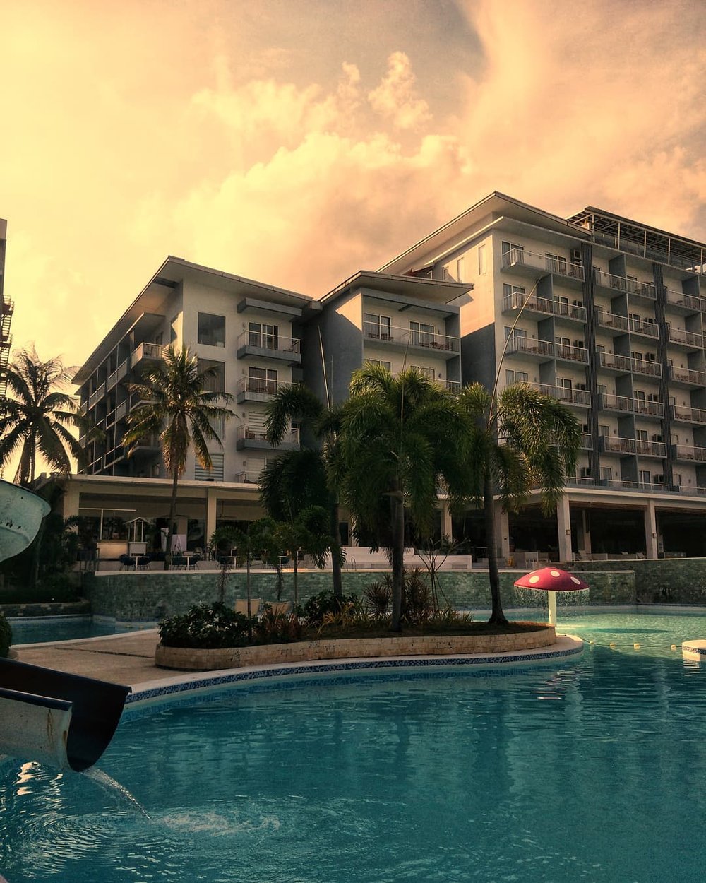 hotel pool with orange skies