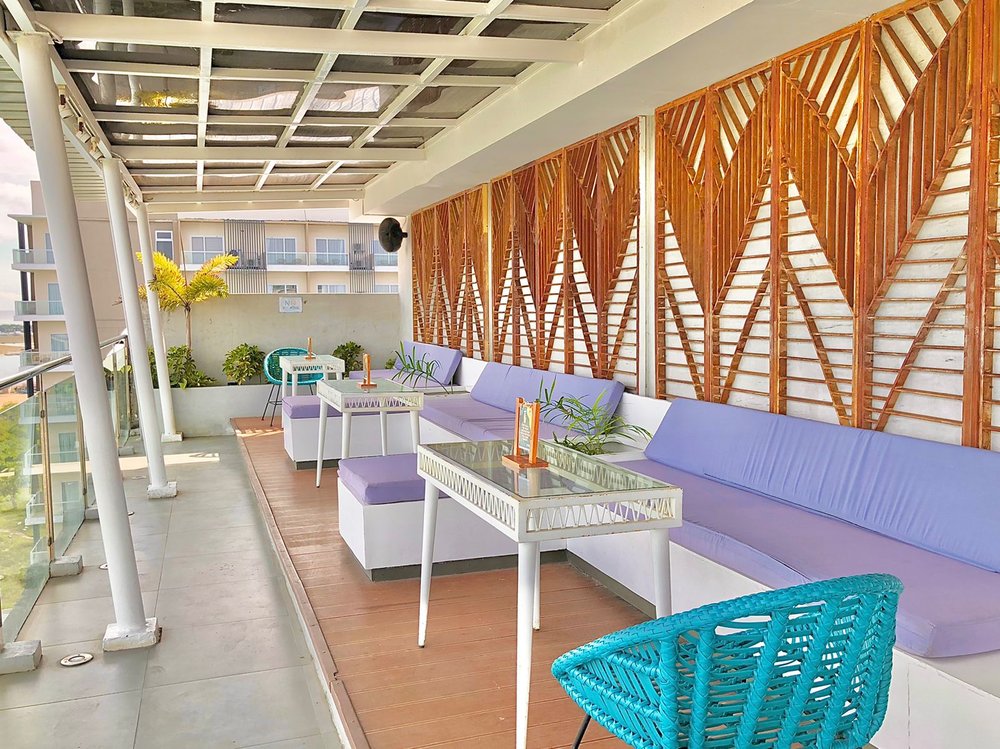 hotel rooftop lounge with pastel color theme