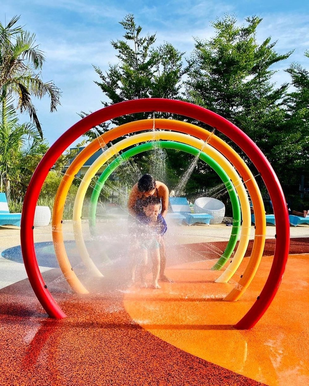 mother and daughter having fun in water park