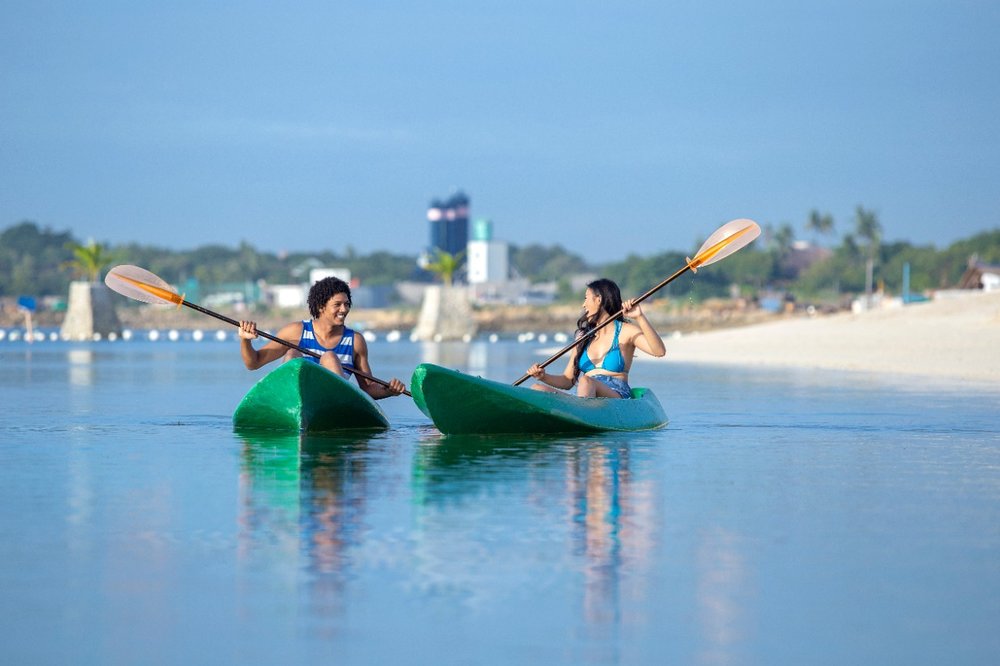 couple kayaking at the beach