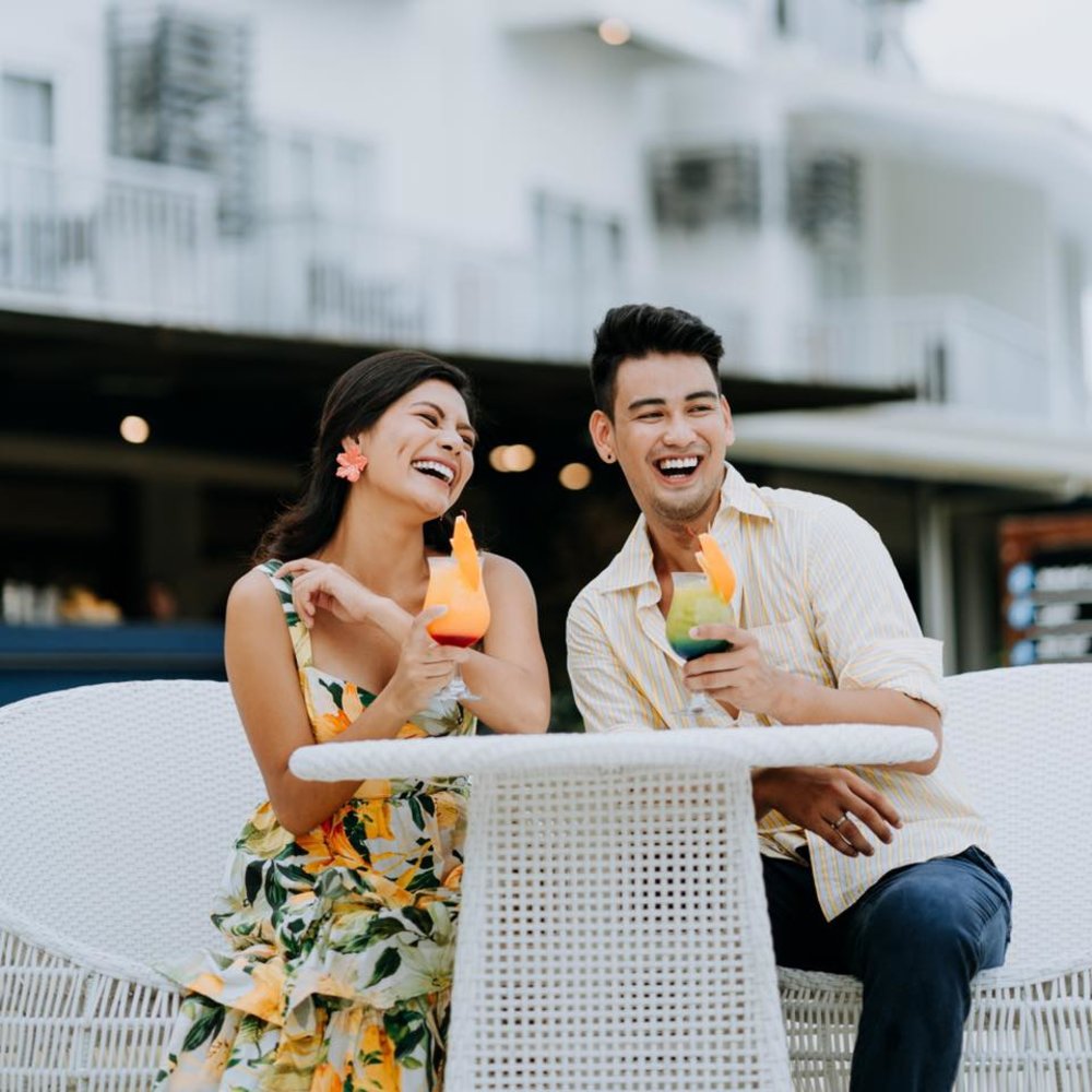 couple smiling and having drinks