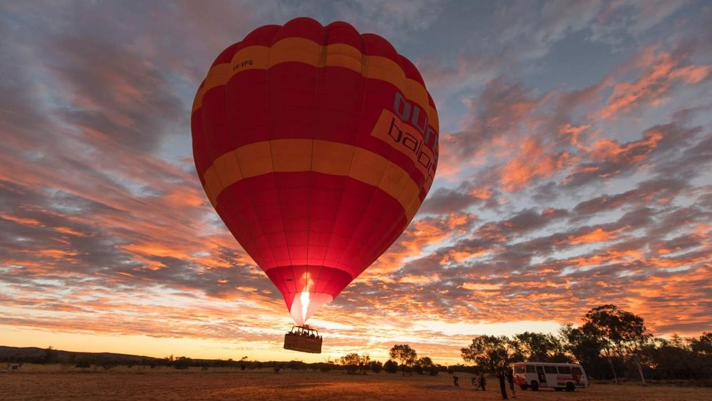 Marvel at Alice Springs as its lit up in gorgeous sunset colours