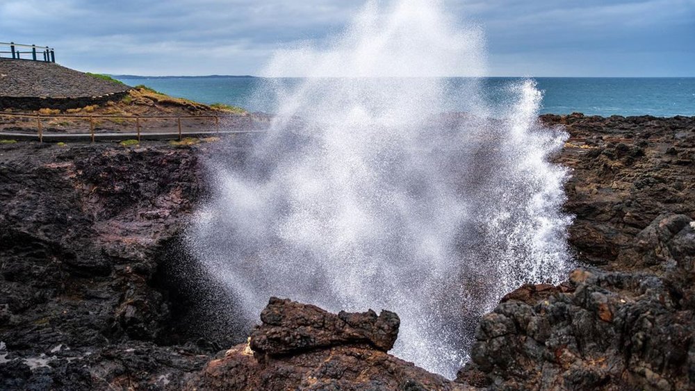 See the rock formation spout seawater into the air. Image credit: @stevecfagan on Instagram