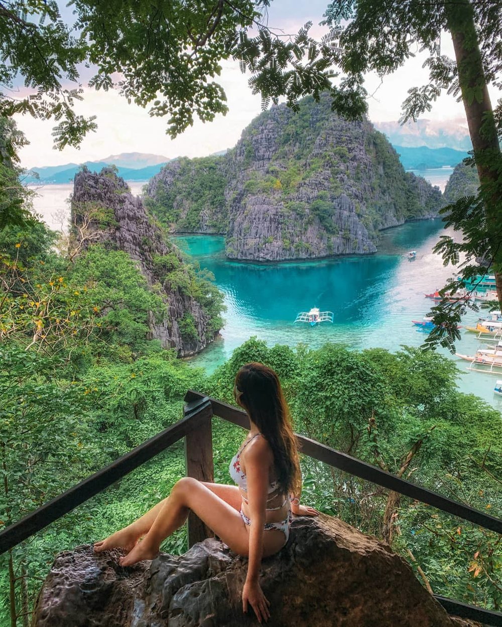 woman posing in rock with view of limestone cliffs