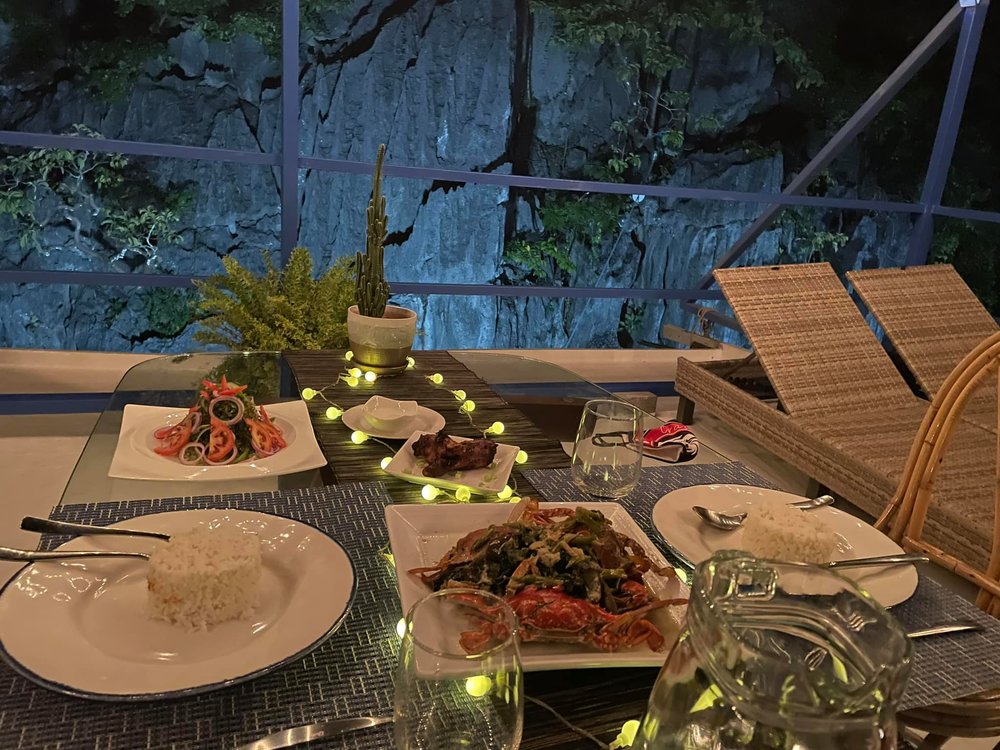 romantic dinner with limestone cliff backdrop