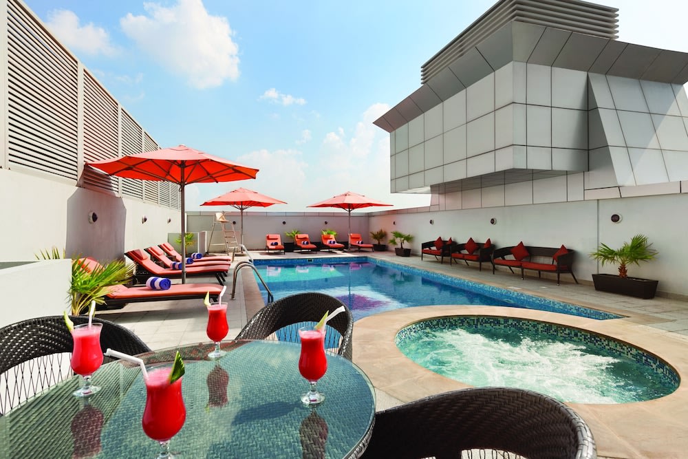 Enjoy a refreshing cocktail by the pool at Ramada.