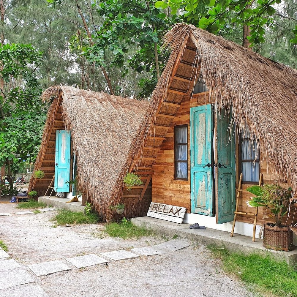 a frame nipa huts with blue doors