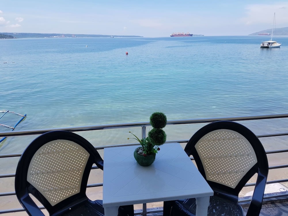 table and chairs in corner with view of sea