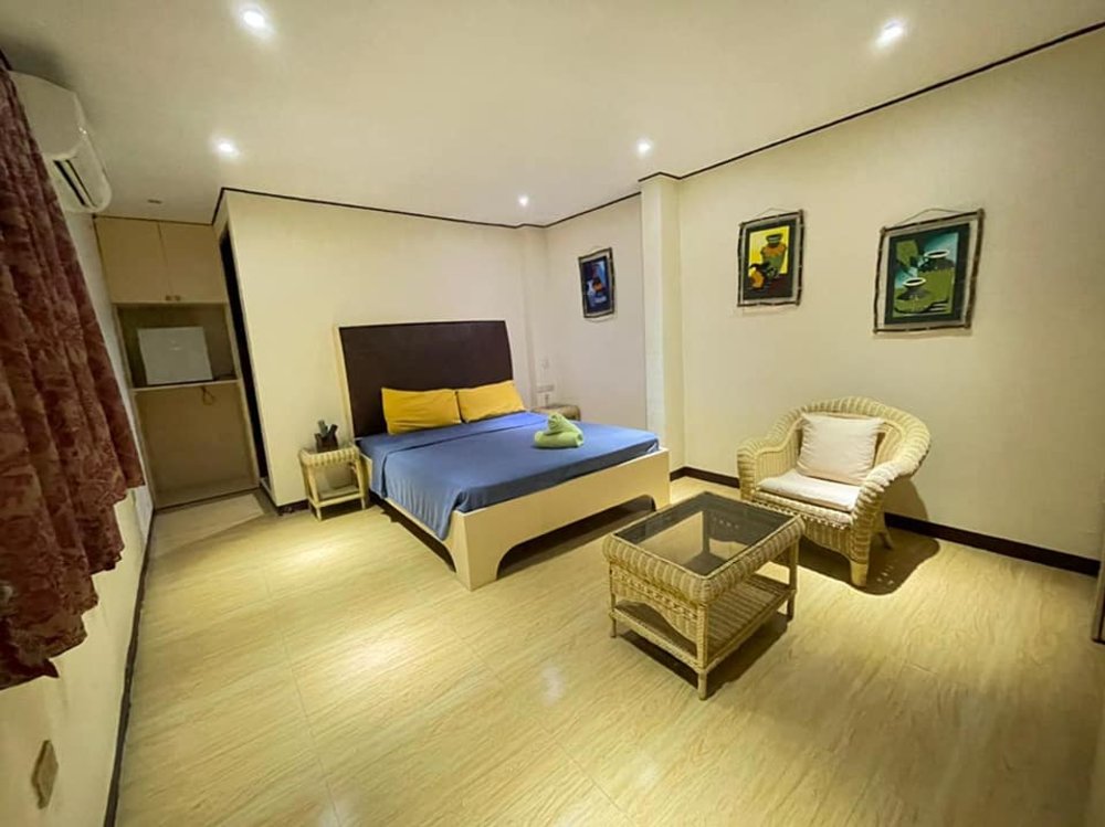 hotel room with bed chair and table