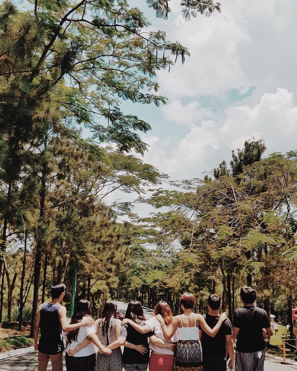 back shot of group of friends huddled together 