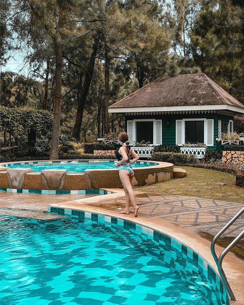 woman standing near swimming pool