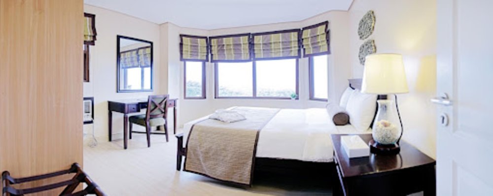 hotel room with lots of natural light