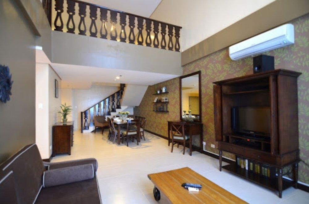 spacious hotel loft room with wallpaper