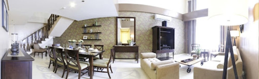 big hotel room with living and dining room