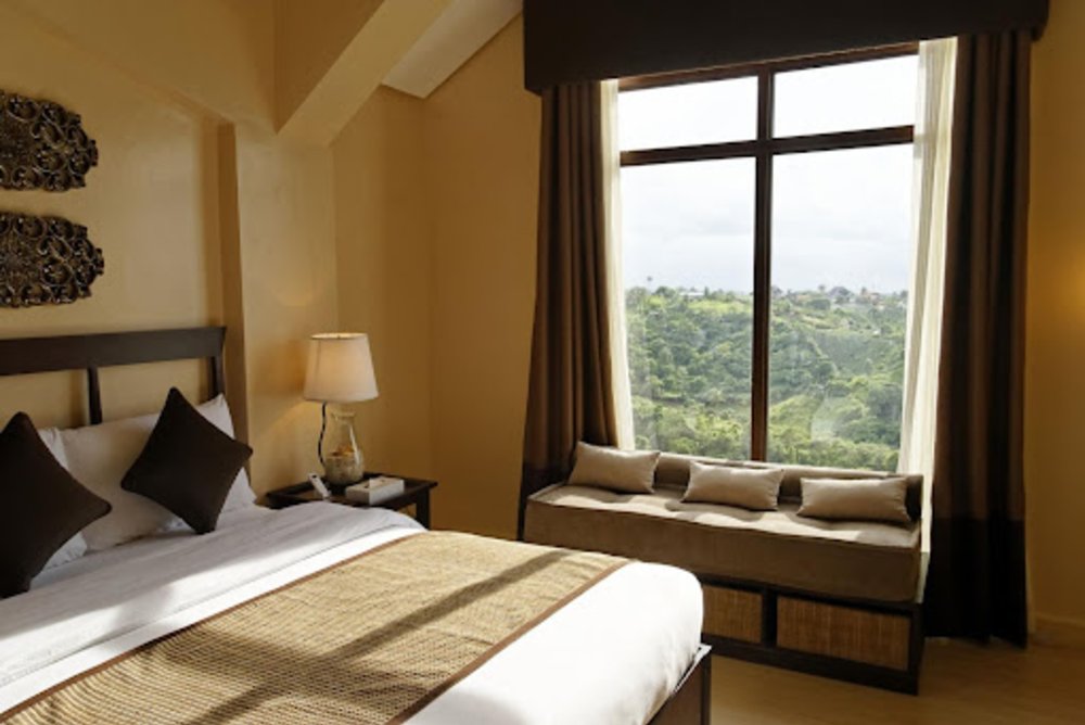 hotel room with floor to ceiling window