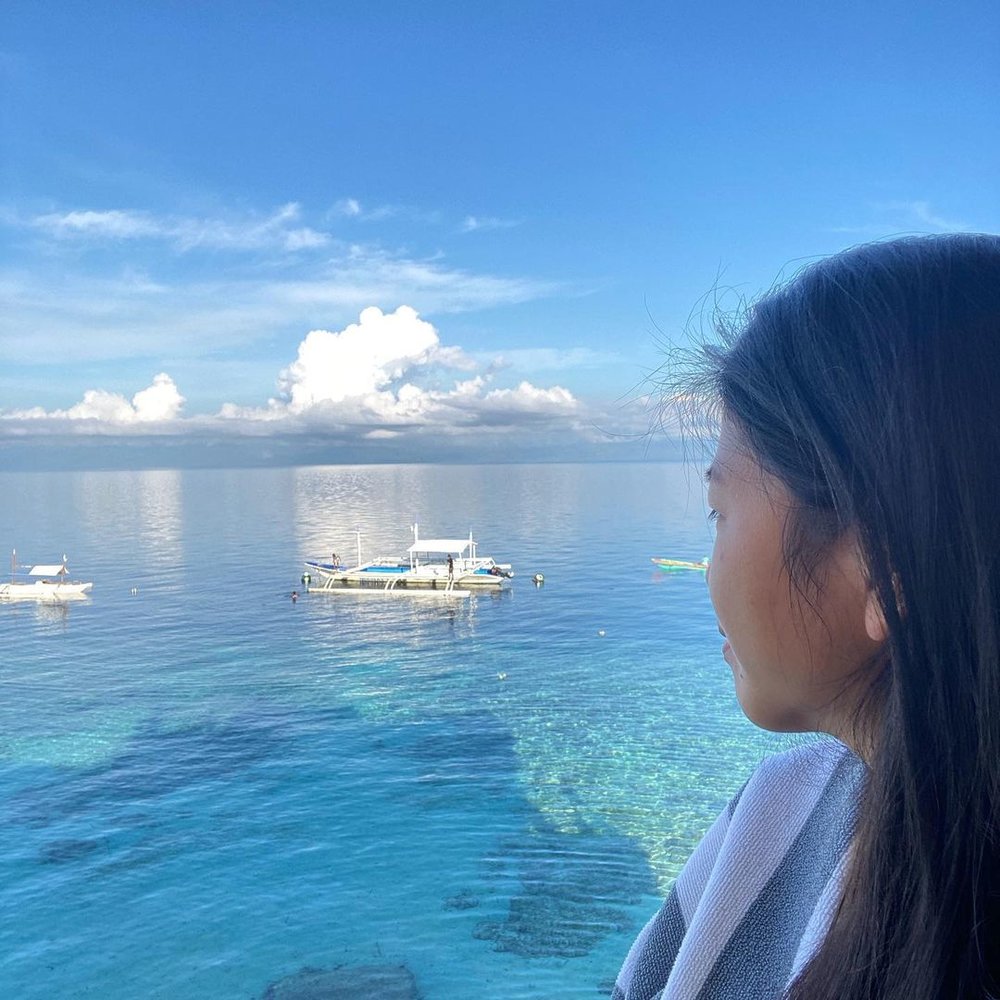 close up shot of woman looking out to sea