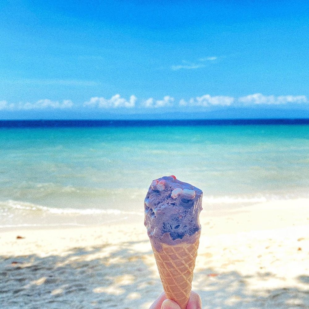 shot of ice cream cone by the beach