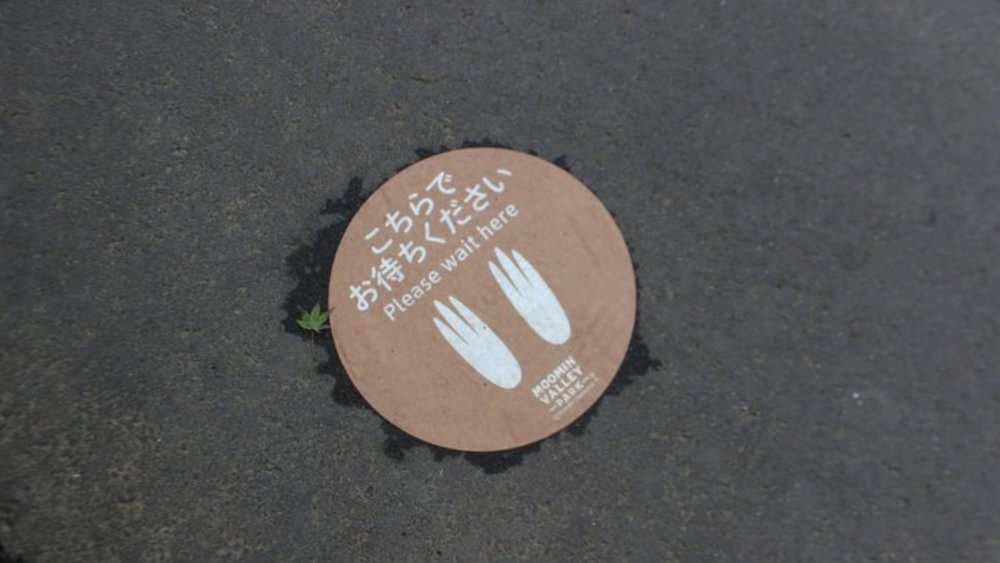 There are character footprint signs everywhere in the park to indicate social distancing.