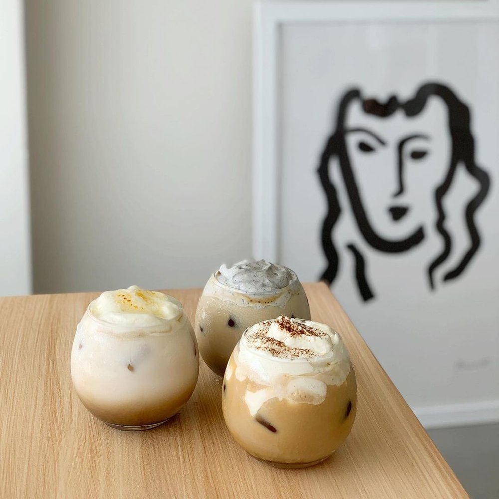 frothy coffees on table