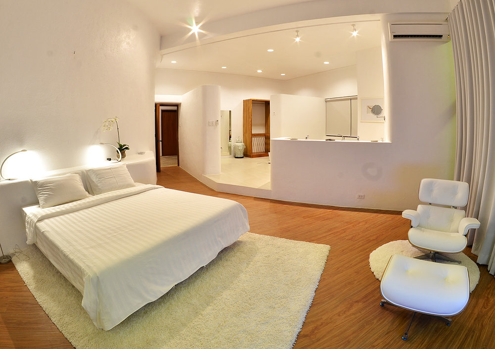 master bedroom with lounge chair