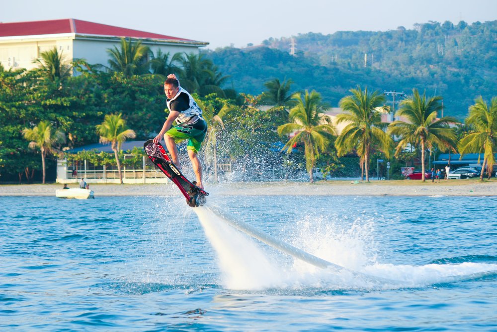 man doing water sports in beach