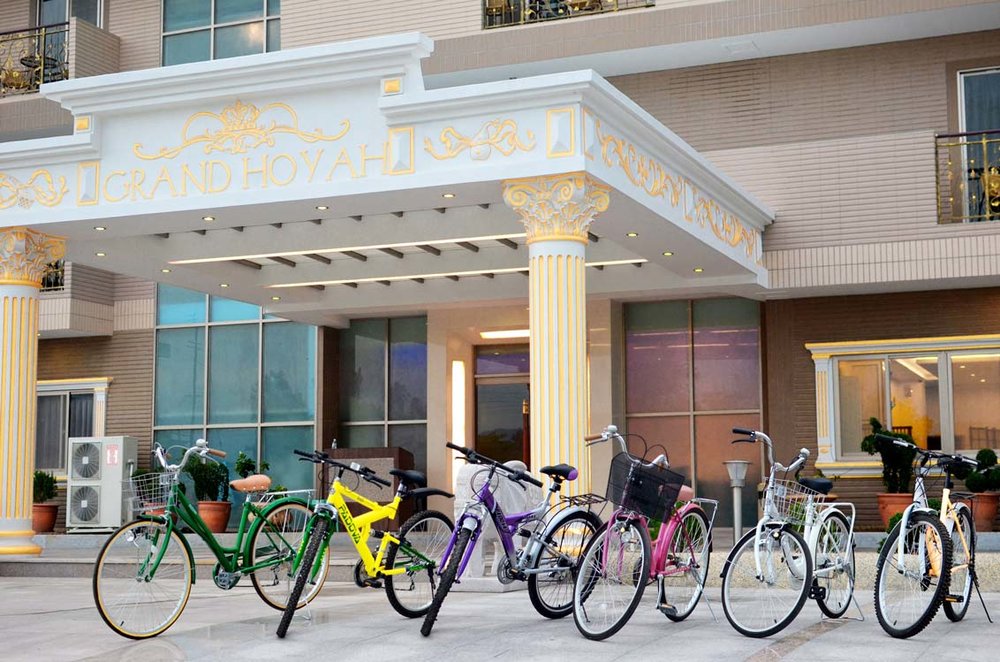 grand hotel entrance with gold pillars